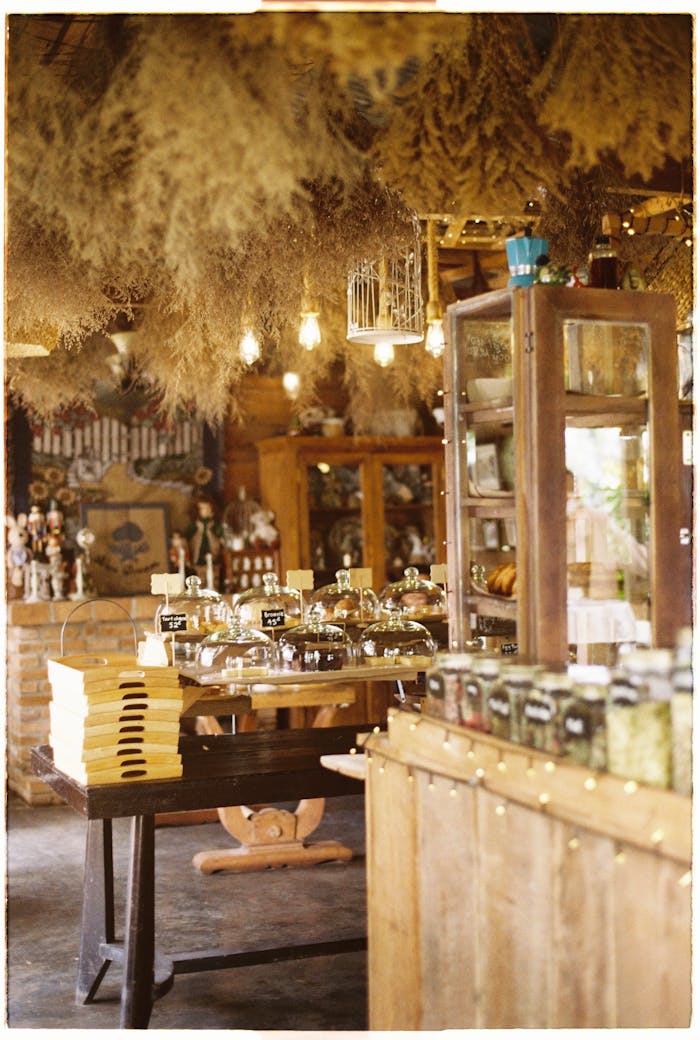 our-story Cozy rustic shop interior filled with wooden decor and assorted items for sale.