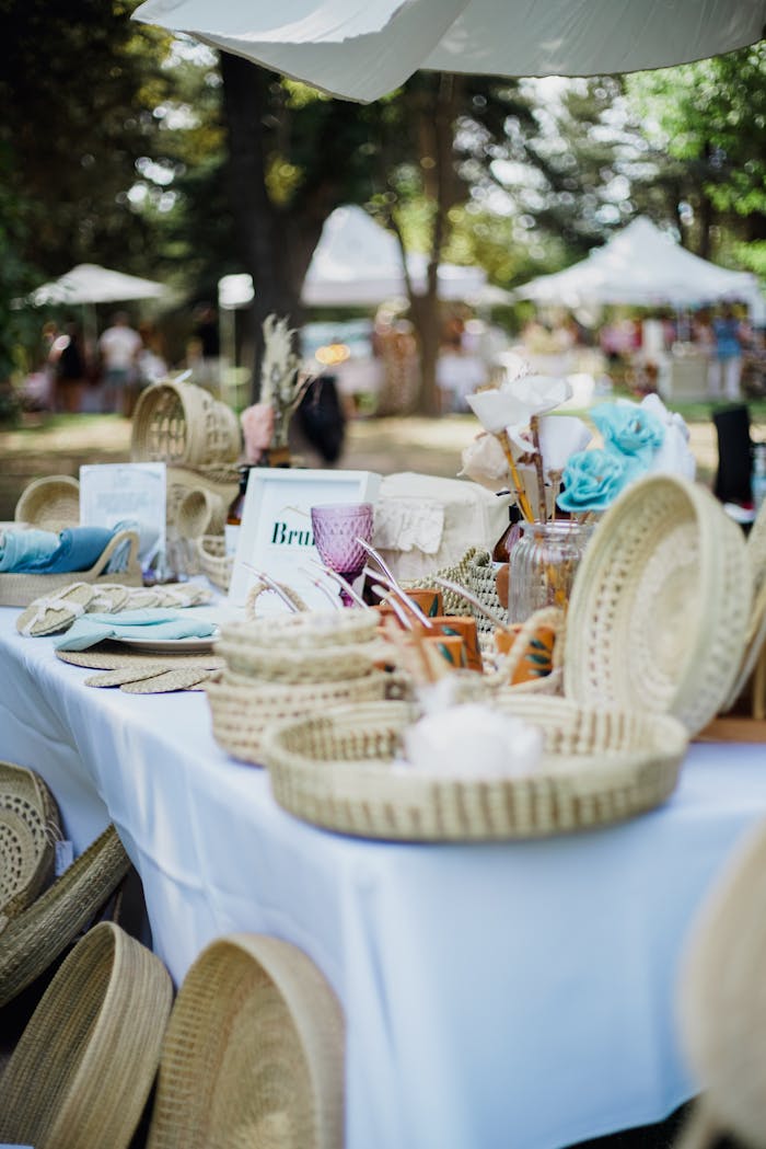 Services-02 Vibrant outdoor market display featuring various handcrafted wicker baskets and elegant decor.